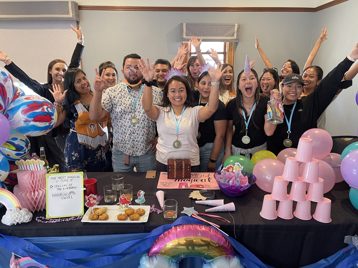 A large group celebrating behind its completed cantina